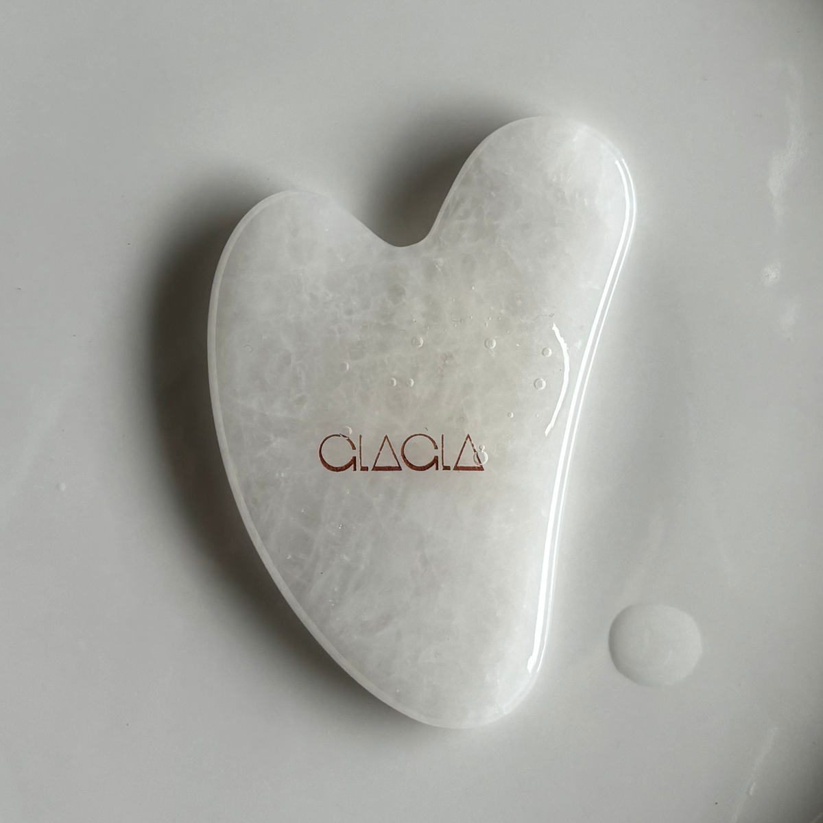 White jade facial gua sha by CLAGLA.